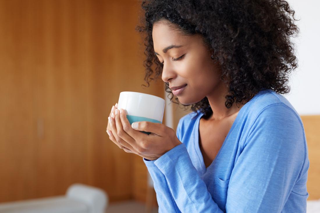 Woman with mug of coffee.
